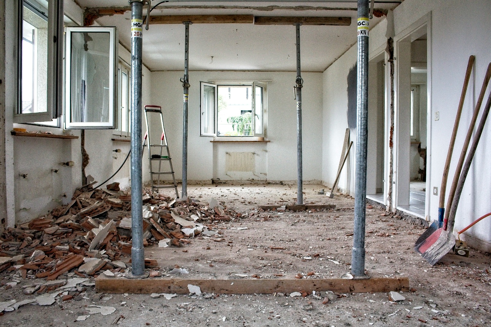 Renovation work in progress room with ladder and paint buckets